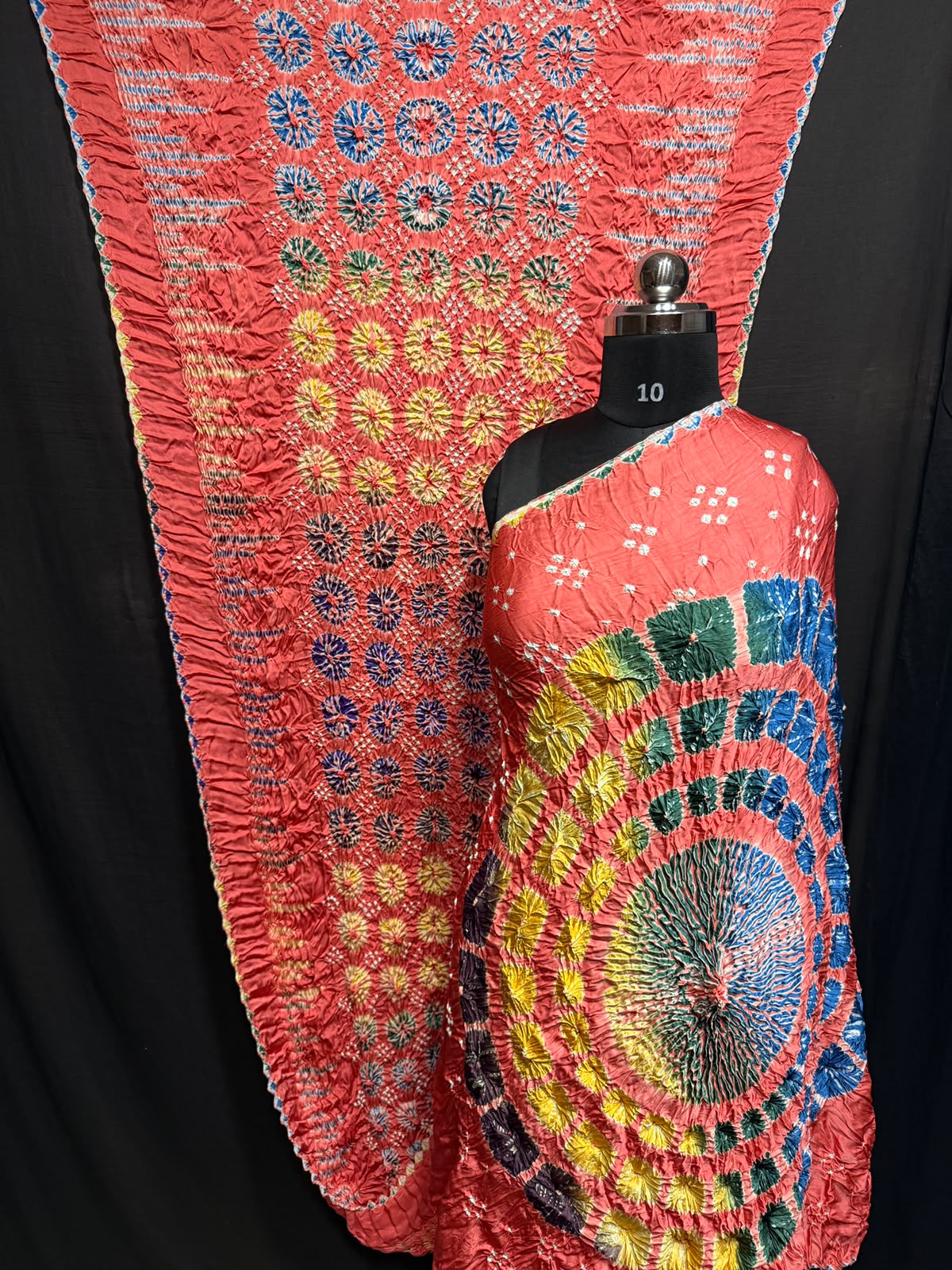 ## Sibori with Bandhej Saree ##
**Fabric**: Modal Silk
- Multi Sibori design
- Handcrafted item
**Description**:
- **Length**: 6.50 meters
- **Width**: 44-46 inches
- **Wash Care**: Dry clean only