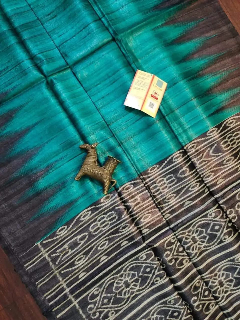 Pure tussar ghicha temple border ikkat print silk handloom saree with blouse pc.
Silk mark tag