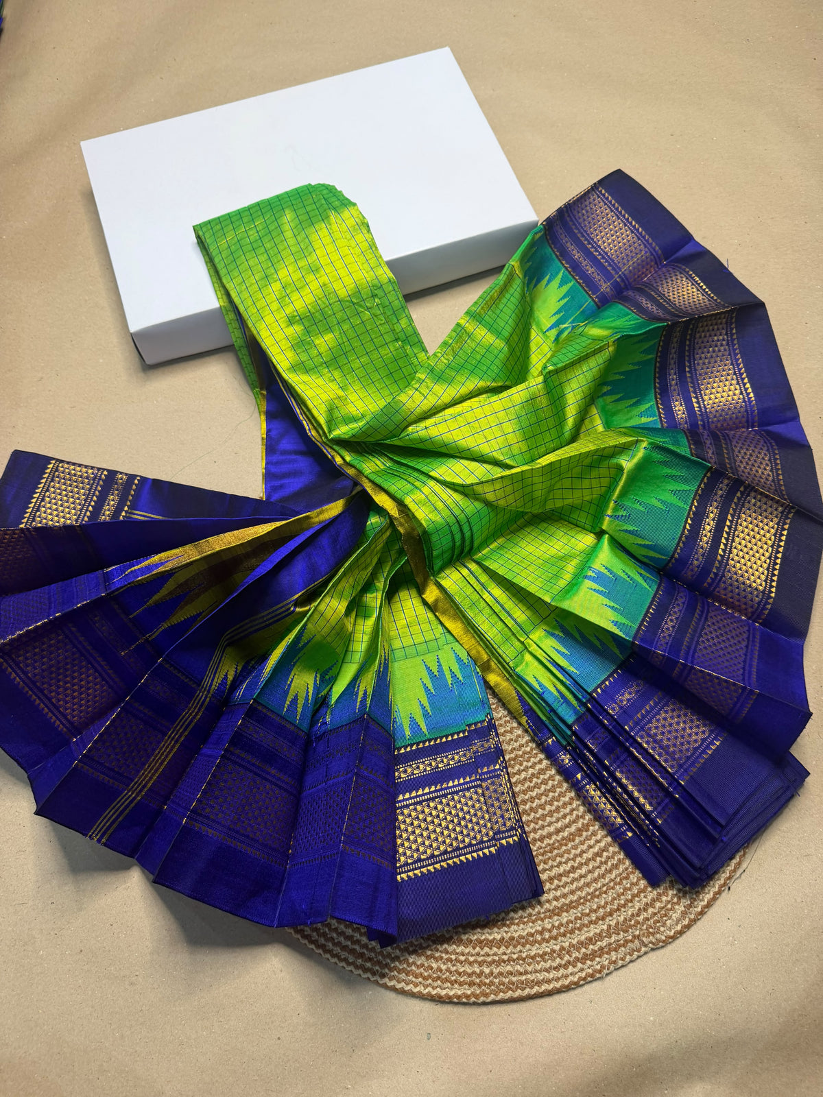 Material - pure silk
Border - chikki paras
Saree Name -ilkal pure silk small kaddi checks with small temple border saree
Pallu -multi tope silk pallu
Blouse -contrast
Handloom -yes
Saree length- 6.2