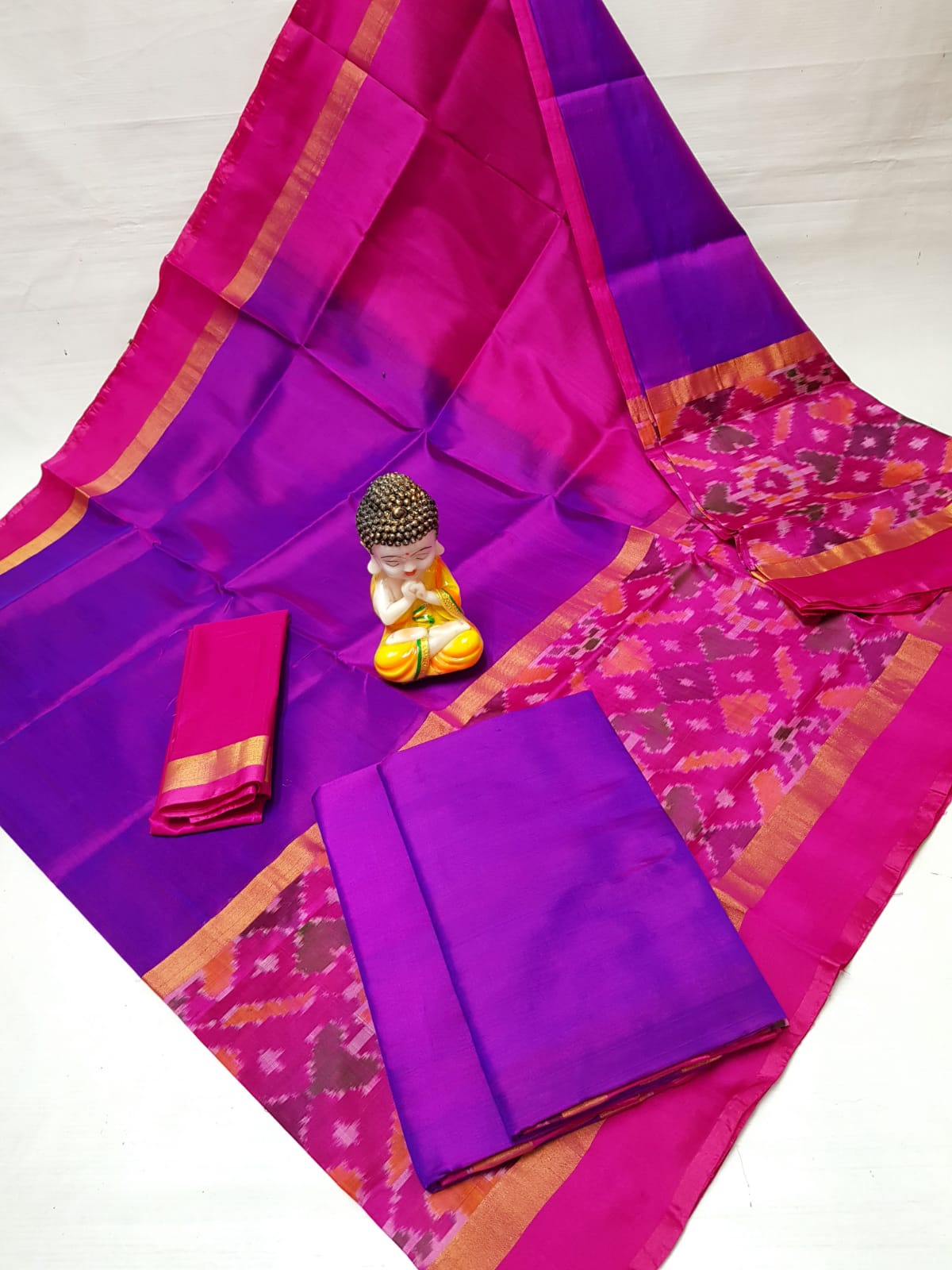 Handwoven Uppada pure silk saree in pinkish orange with ikat border