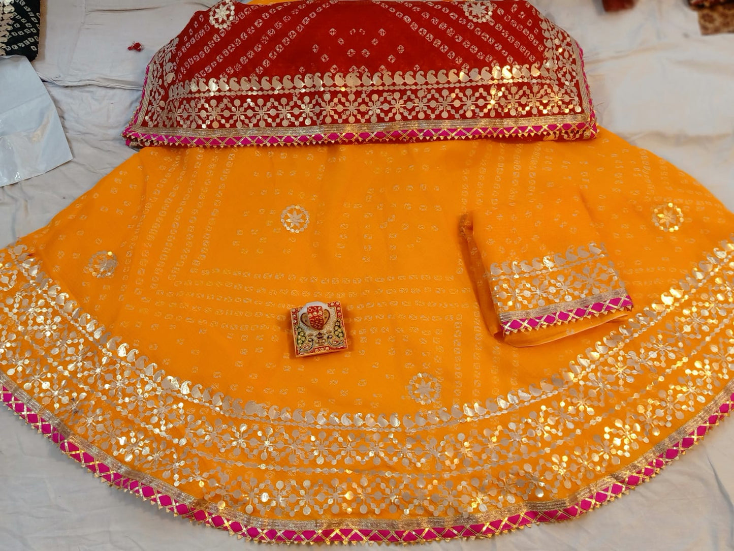 Bandhni lehengas in gota patti