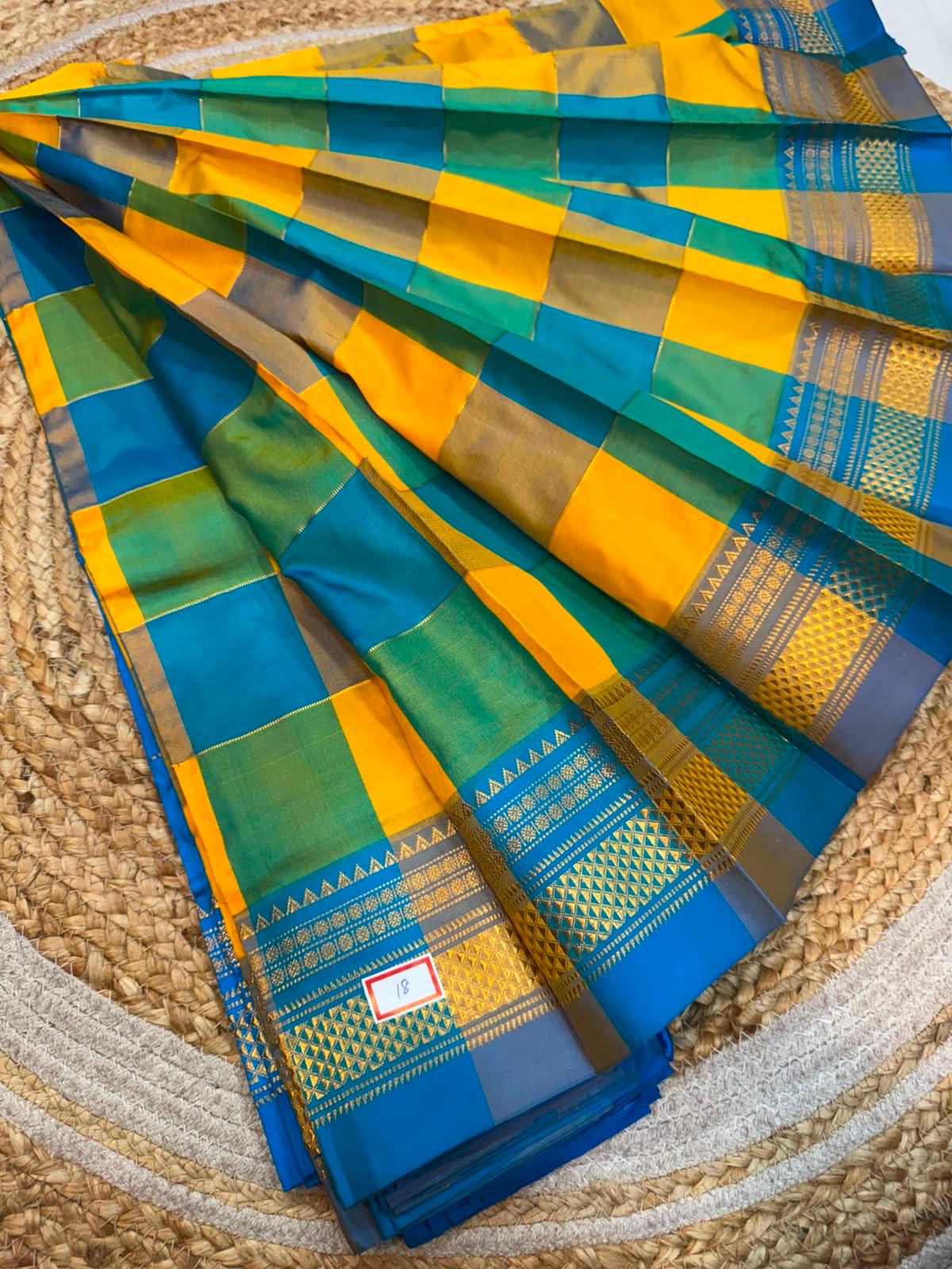 *ILKAL SAREE WITH SILK MARK* 

Exclusive premium quality pure silk Multi colour checks with zari lines design ilkal saree With Fancy Temple design Jari Pallu and contrast blouse 
6.10mtrs length 
Premium quality ilkal saree 

