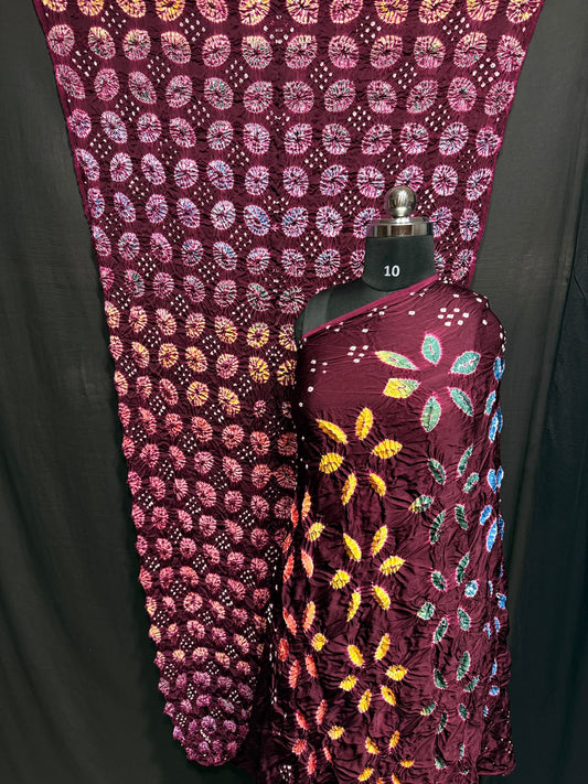 ## Sibori with Bandhej Saree ##
**Fabric**: Modal Silk
- Multi Sibori design
- Handcrafted item
**Description**:
- **Length**: 6.50 meters
- **Width**: 44-46 inches
- **Wash Care**: Dry clean only