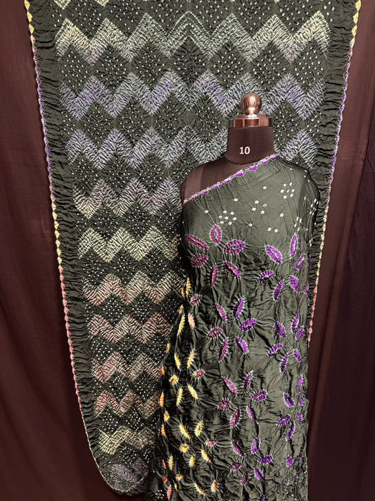## Sibori with Bandhej Saree ##
**Fabric**: Modal Silk
- Multi Sibori design
- Handcrafted item
**Description**:
- **Length**: 6.50 meters
- **Width**: 44-46 inches
- **Wash Care**: Dry clean only