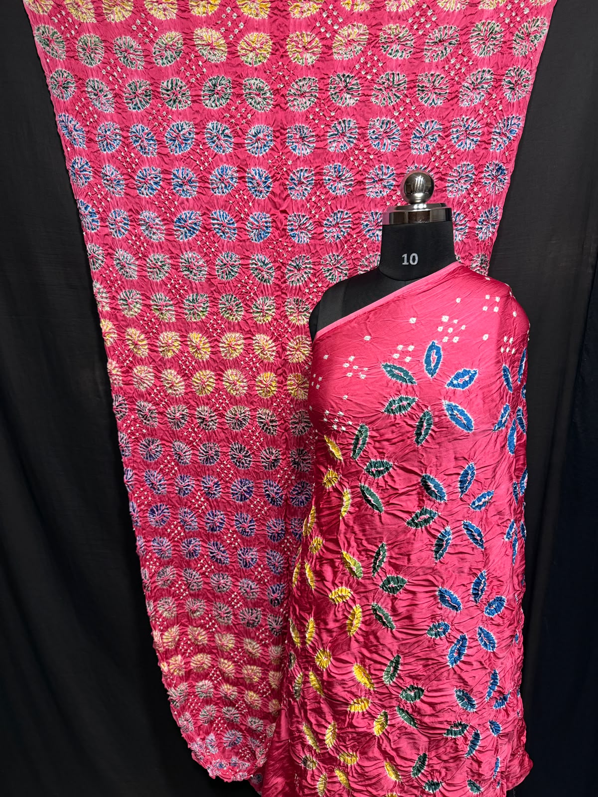 ## Sibori with Bandhej Saree ##
**Fabric**: Modal Silk
- Multi Sibori design
- Handcrafted item
**Description**:
- **Length**: 6.50 meters
- **Width**: 44-46 inches
- **Wash Care**: Dry clean only