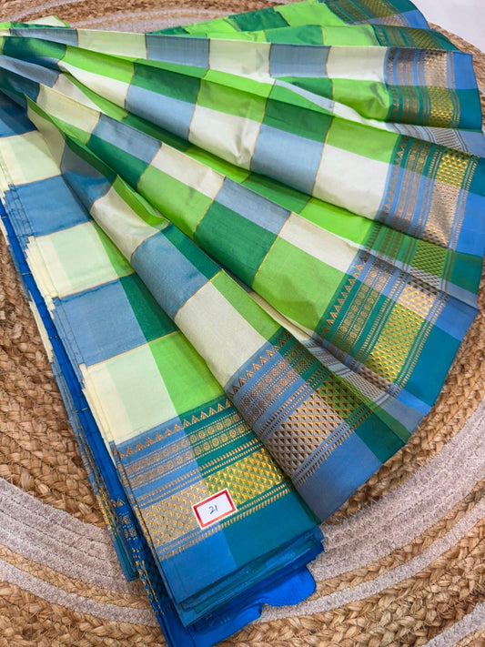 *ILKAL SAREE WITH SILK MARK* 

Exclusive premium quality pure silk Multi colour checks with zari lines design ilkal saree With Fancy Temple design Jari Pallu and contrast blouse 
6.10mtrs length 
Premium quality ilkal saree 
