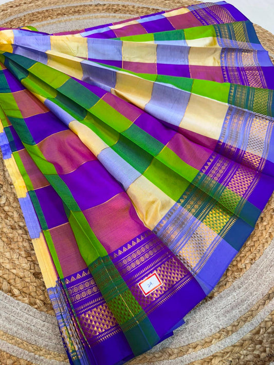 *ILKAL SAREE WITH SILK MARK* 

Exclusive premium quality pure silk Multi colour checks with zari lines design ilkal saree With Fancy Temple design Jari Pallu and contrast blouse 
6.10mtrs length 
Premium quality ilkal saree 
