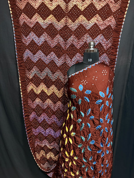## Sibori with Bandhej Saree ##
**Fabric**: Modal Silk
- Multi Sibori design
- Handcrafted item
**Description**:
- **Length**: 6.50 meters
- **Width**: 44-46 inches
- **Wash Care**: Dry clean only