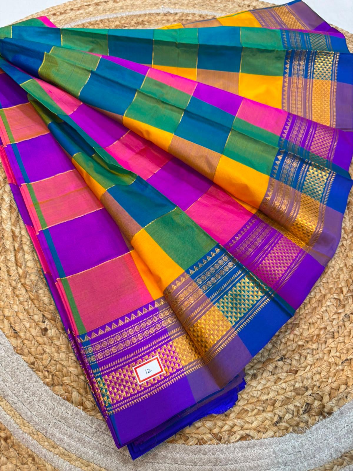 *ILKAL SAREE WITH SILK MARK* 

Exclusive premium quality pure silk Multi colour checks with zari lines design ilkal saree With Fancy Temple design Jari Pallu and contrast blouse 
6.10mtrs length 
Premium quality ilkal saree 
