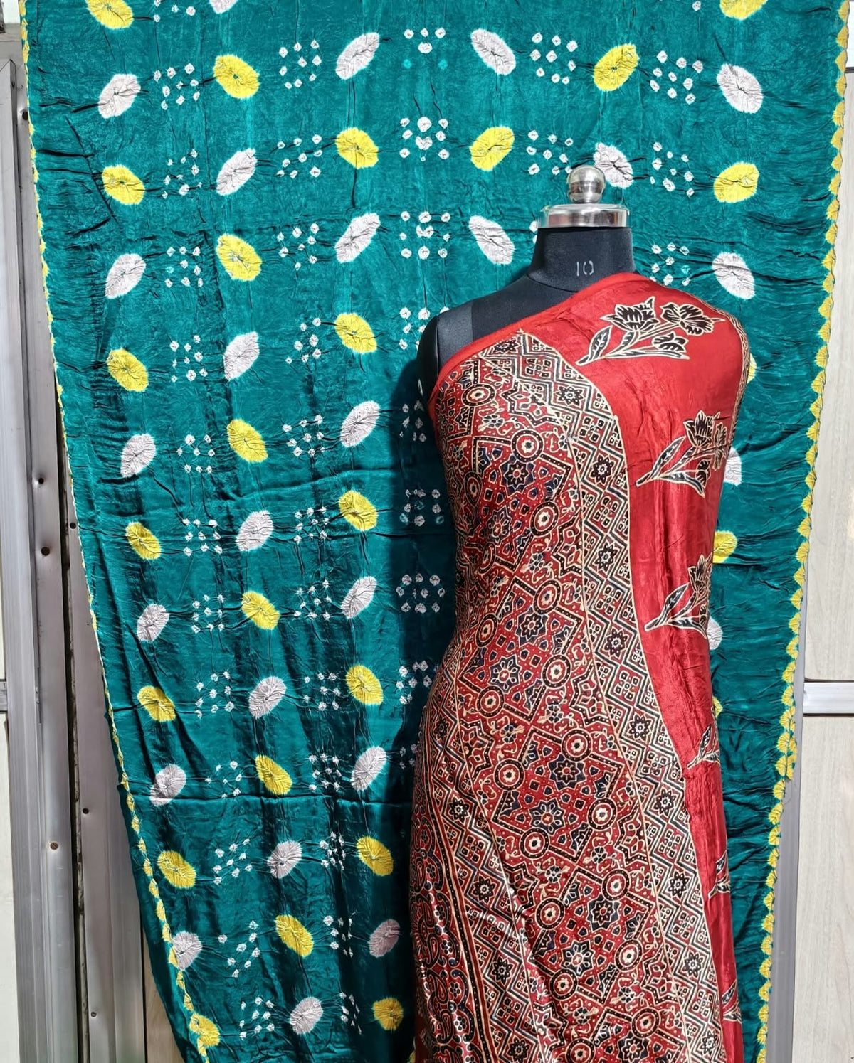✨ Pure Modal Silk Ajrakh Shibori saree✨*

*🌸 Premium Natural Dye Ajrakh Hand Block Print with Shibori hand bandhej saree*

*👗 Fabric Details*:

• *saree 6.50 miter . Full cut*..

*⭐ Highlights*

• 100% Premium Quality

• Natural Dye

• Authentic Ajrakh Hand Block Print

• Elegant Shibori Design

• Soft, Comfortable & Rich Finish